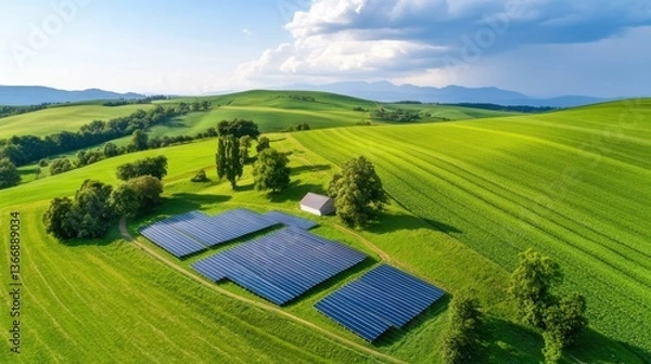 Fototapeta Earth Day  sustainability restoration Aerial view of solar panels in a green landscape under a cloudy sky.