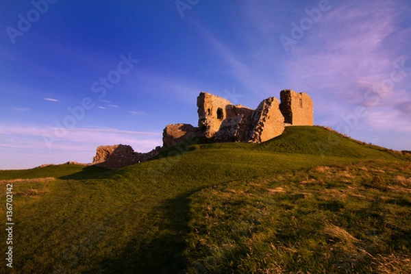 Fototapeta Duffus Castle, Elgin, Moray, Scotland is a ruined stone built motte and bailey fortress first constructed in the 12th century and finally abandoned in 1705.