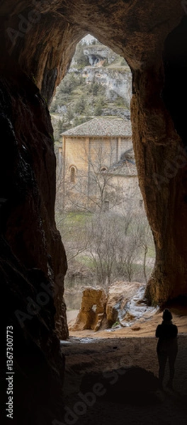 Fototapeta Exploring a Historic Stone Building from a Cave