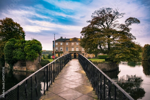 Fototapeta Walton Hall in a scenic setting of rolling parkland with its own