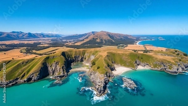 Fototapeta Scenic Aerial Shot of a Hidden Beach Surrounded by Rugged Coastal Cliffs and Ocean Waves Aerial View of a Remote Tropical Island Surrounded by Turquoise Waters and Coral Reefs