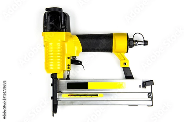 Obraz Yellow stapler pneumatic combi on a white background