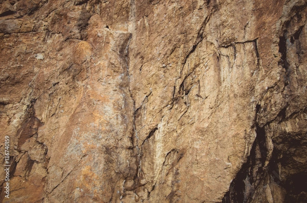 Fototapeta Red Stones - Rock in Gurzuf Valley, on the southern coast of Crimea (Yalta region), situated at an altitude of 430 meters above sea level, made of marble-like limestone pinkish-yellow.