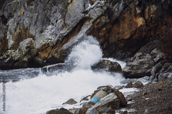 Fototapeta Sea waves crash on the rocks on the beach. Sea shtormit. Splashing waves.
