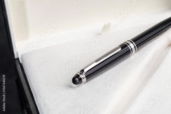 Fototapeta Fountain pen on marble and grey background. Selective focus.