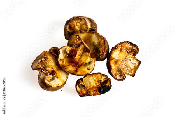 Fototapeta fried mushrooms on a grill on a white background for isolation