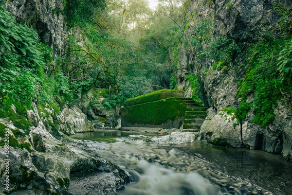 Obraz Mountain gorge with caves and little river from the portuguese touristic site of Olhos de Agua - Alviela - Alcanena