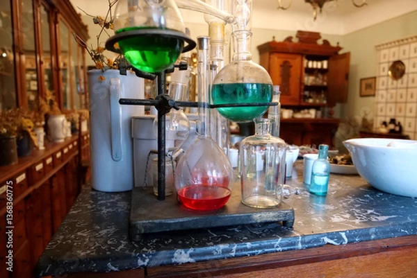 Obraz Chemistry beakers,bottles and flasks with liquids in laboratory of old pharmacy