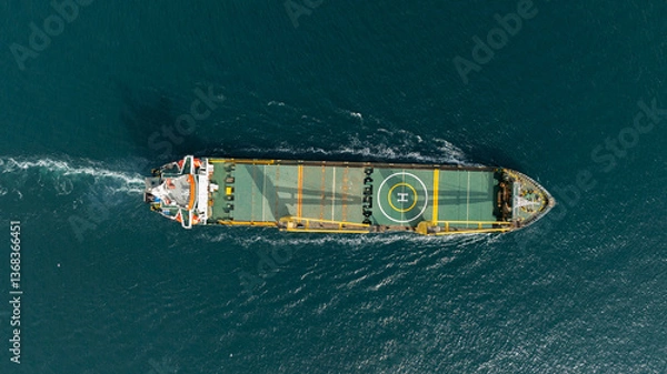 Fototapeta Tanker ship passing under the FSM Bridge with a heavy car traffic on the bridge.Aerial view of The Second Bosphorus Bridge or Fatih Sultan Mehmet Bridge, Istanbul.