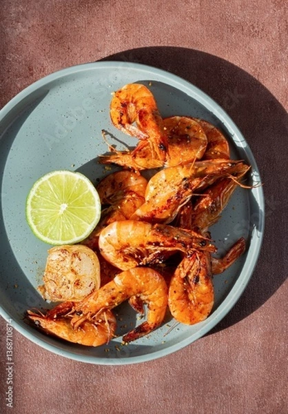 Obraz Marinated shrimp in a spicy grill with lime and garlic. Delicious fresh seafood, Mediterranean cuisine.