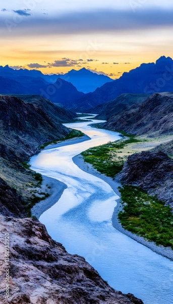 Fototapeta Serpentine river meandering through a majestic canyon at sunset