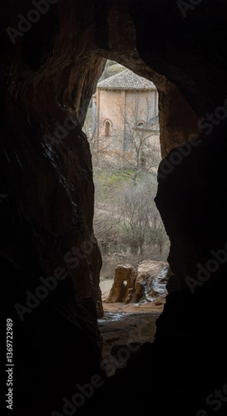 Fototapeta Discovering a Hidden Chapel Through a Cave Opening