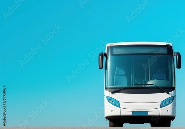 Fototapeta Front view of a modern white bus against a clear blue sky