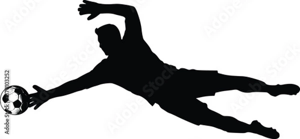 Fototapeta Soccer player diving for a football in a black and white silhouette action scene