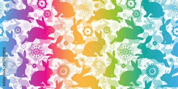 Fototapeta Vector seamless pattern with hand drawn colorful Easter bunnies and flowers on a white background. For textile, wallpaper and packaging