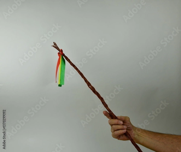 Obraz Traditional Czech Easter whip with colored ribbons 
from willow branches in my hand