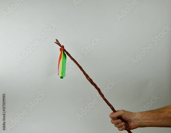 Obraz Traditional Czech Easter whip with colored ribbons 
from willow branches in my hand