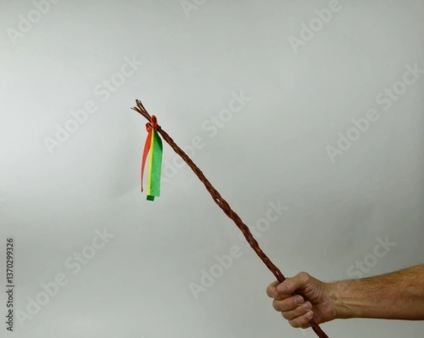 Obraz Traditional Czech Easter whip with colored ribbons 
from willow branches in my hand