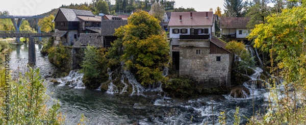 Obraz Panoramic photograph of the Rastoke Waterfalls, where the Slunjčica River meets the Korana River, creating a dreamlike landscape. Rastoke, Croatia