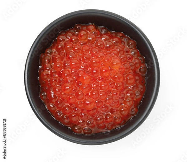 Fototapeta Delicious red caviar in bowl isolated on white, top view