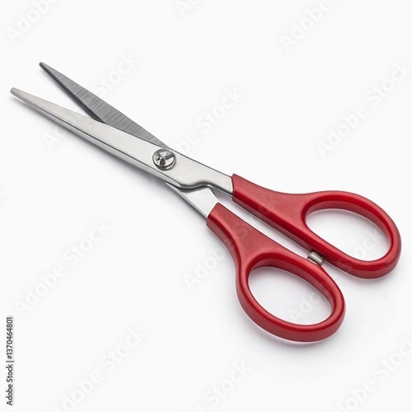 Fototapeta A modern pair of scissors with sleek silver blades and red rubber-coated handles, isolated on a white background