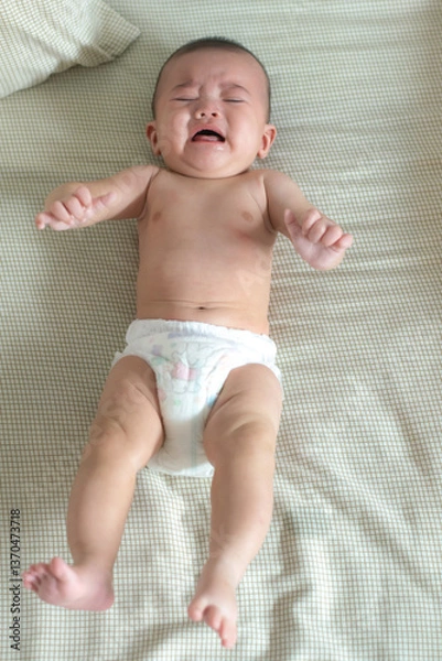 Obraz Baby crying on a bed