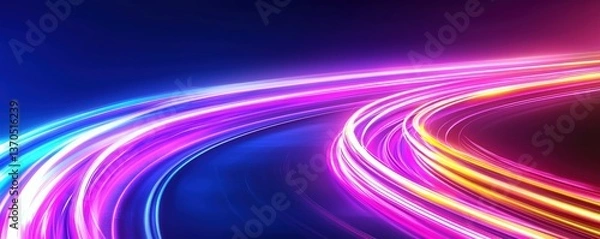 Fototapeta A vibrant display of colorful light trails curving against a dark background, creating a sense of motion and energy.