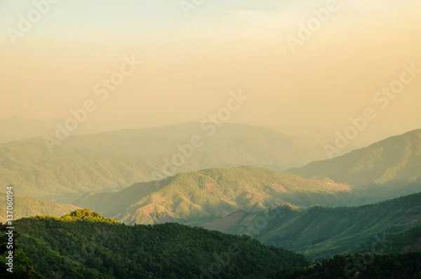 Obraz View of sun shine sky and layers of the mountains in winter season at a morning in northern Thailand