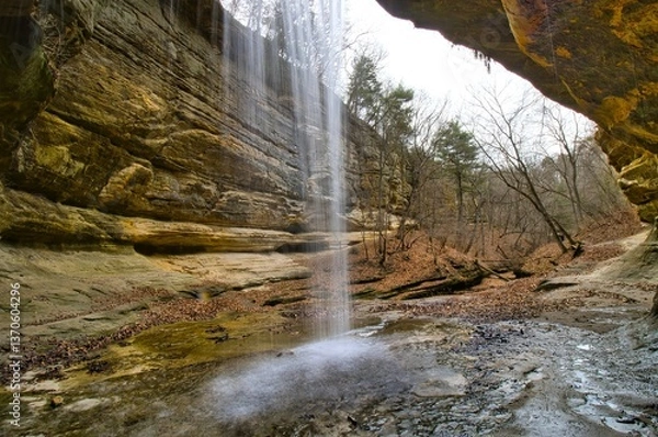 Obraz Early Spring landscape looking out from behind the LaSalle Canyon waterfall at Starved Rock State Park near Oglesby, Illinois.