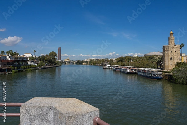 Fototapeta View of the Torre del Oro tower and the Guadalquivir river in Seville.