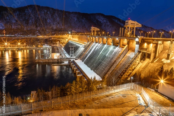 Fototapeta View of hydroelectric dam at dusk illumination winter