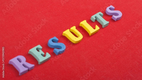 Obraz RESULTS word on red background composed from colorful abc alphabet block wooden letters, copy space for ad text. Learning english concept.