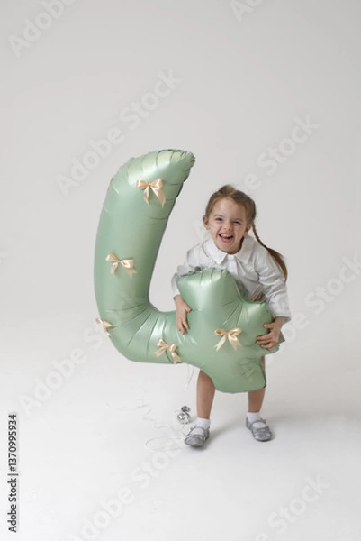 Fototapeta happy little girl go crazy with ballon in 4 number shape