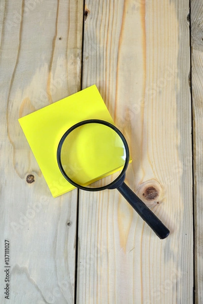 Obraz Magnifying glass on yellow sticky note