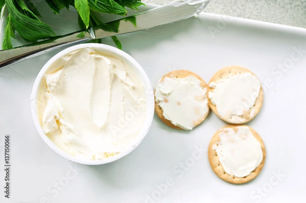 Fototapeta Cream cheese crackers on plate