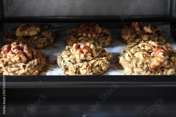 Obraz Homemade oat and banana cookies in the oven, dessert for vegan