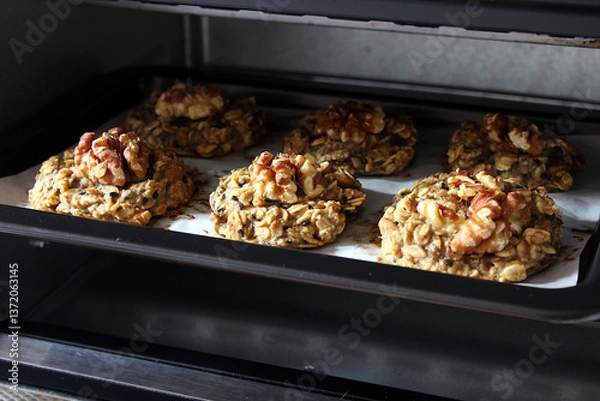 Obraz Homemade oat and banana cookies in the oven, dessert for vegan