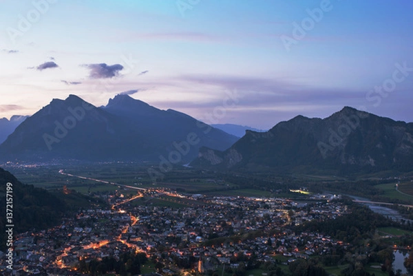 Fototapeta Panorama of the city of Bad Ragaz against the background of the Swiss Alps at sunset. Bad Ragaz Switzerland. Aerial view. Top view