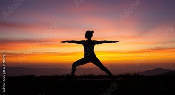 Obraz Silhouette of a person practicing yoga during a beautiful sunset