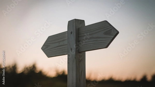 Obraz Wooden Arrow Signpost Against Gradient Sky, Symbolizing Direction and Simplicity