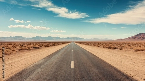 Obraz A mesmerizing desert highway stretching towards the distant horizon under a vast sky