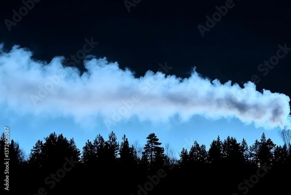 Obraz Smoke plumes above a dark silhouette of forested tree tops