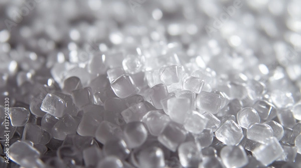 Fototapeta A close-up view of plastic polymer granulate shows small, uniform pellets ready for molding.

