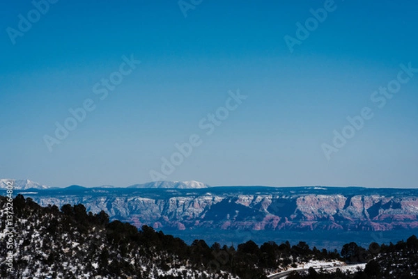 Fototapeta desert and snowy mountain landscape with blue sky