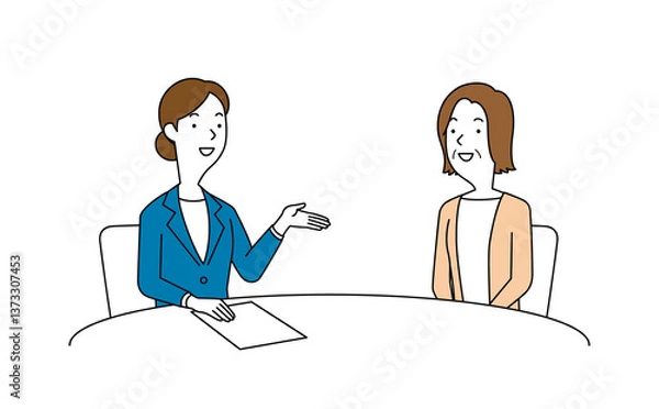 Obraz 女性の相談員にアドバイスを聞く高齢の女性