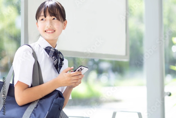 Obraz バス停に座る中学生