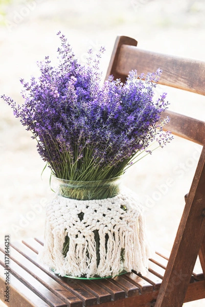 Obraz bouquet of lavender on a chair in the garden