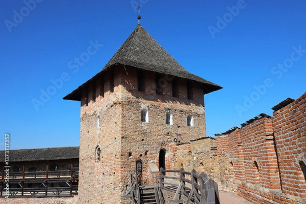 Fototapeta Lubart's Castle, Lutsk, Ukraine. Towers, defensive walls, wooden galleries and stairs, inner courtyard