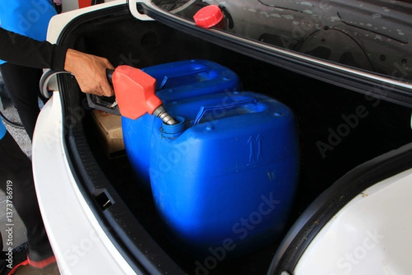 Fototapeta When the government announced a fuel price hike, people started hoarding fuel and filling up in advance.