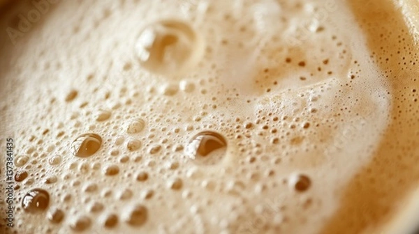 Fototapeta A detailed macro shot of frothy coffee, showcasing the texture of the foam with air bubbles and creamy swirls. Perfect for beverage themes, barista art, or food and drink backgrounds.. AI Generation